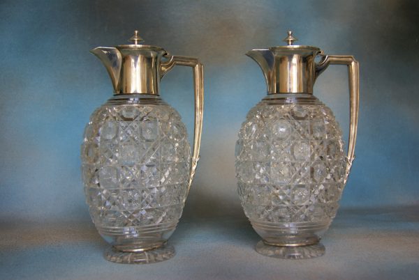 A Pair of Glass Claret Jugs.