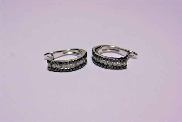 A Pair of 14K White Gold Hoop Style Ear-rings.