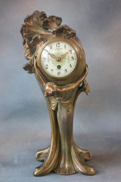 A Late 19th Century Art Nouveau Style Mantel Timepiece. A Late 19th Century Art Nouveau Style Mantel Timepiece.