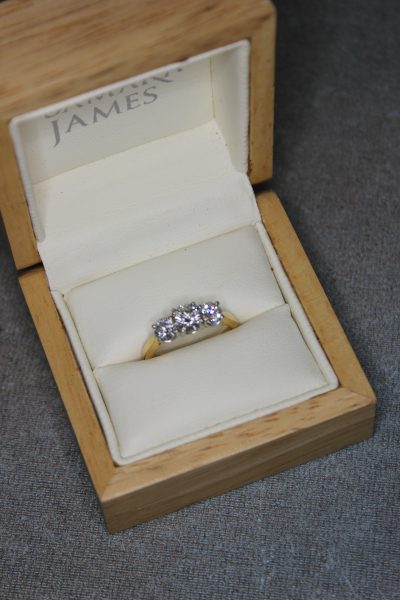 An 18ct Gold Three Stone Diamond Dress Ring.