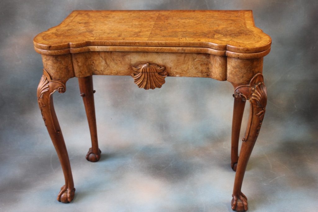 An Early 18th Century Walnut Card Table. An Early 18th Century Walnut Card Table.