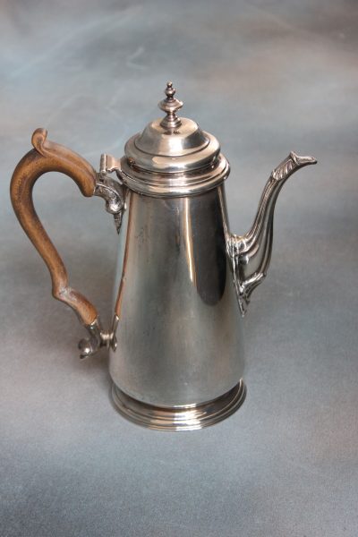 A " Beaverman" Colin Almack Occasional Table. An Elizabeth II Silver Coffee Pot.