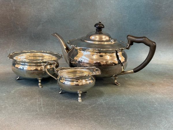 A George V Silver Three-Piece Tea-Set. A George V Silver Three-Piece Tea-Set.